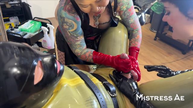 MistressAe – POV latex gloves double domme hand job edging tease with electro stim with Madame Li Ying and our rubber gimp